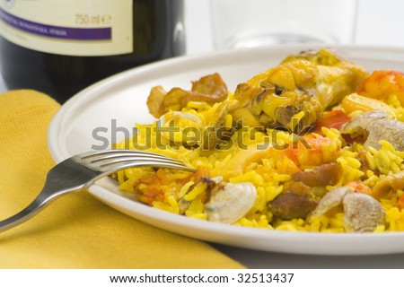 delicious seafood paella and chicken rice yellow isolated