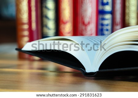 Black book on wooden table
