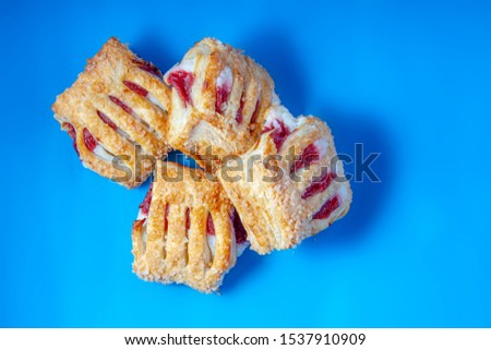 Similar – Image, Stock Photo Strawberry rhubarb strudel cake on light mint kitchen table with knife and ingredients. Top view. Homemade seasonal baking