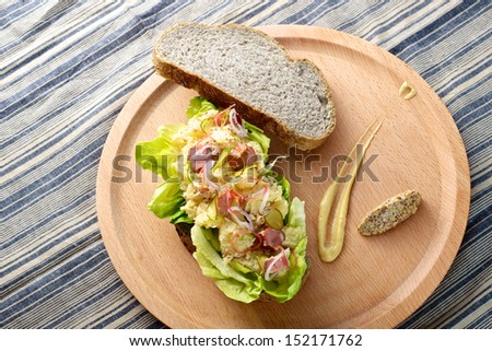 Fresh delicious Potato Salad Sandwich on cutting board