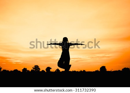 silhouette of woman at sunset , woman fat play yoga ,add grain
