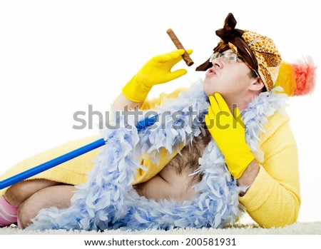 crazy cleaner with a brush cleaner and rubber gloves sitting and resting from the hard work and saving for a house in a yellow robe with a cigarette in his mouth/ crazy cleaner