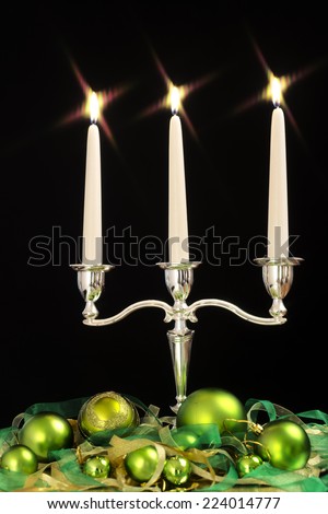 candlestick with three candles and green beads as Christmas and New Year decoration /candlestick with three candles