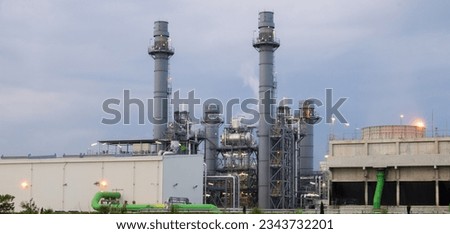 Similar – Image, Stock Photo Gas turbine electrical power plant. Energy for support factory. Natural gas tank. Chimney tower of gas power plant. Power plant using natural gas for fuel. Green energy. Power station against gray sky