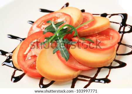 Sliced tomato and smoked cheese