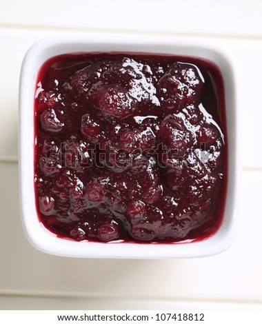 Berry fruit sauce in a square bowl