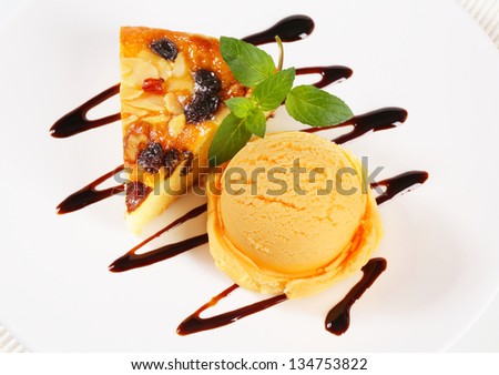 yellow ice cream scoop with piece of honey cake