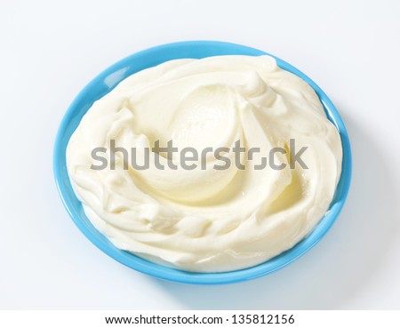 smooth sour cream in a blue bowl