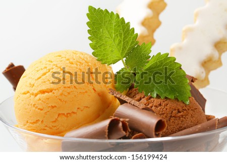detail of ice cream with chocolate curls and biscuits