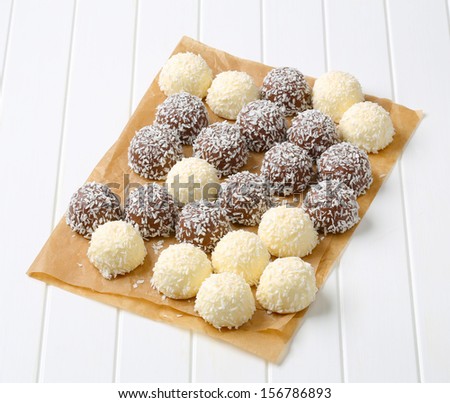 mix of white and dark chocolate pralines on a baking paper