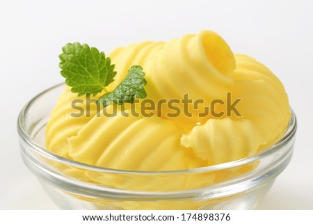 fresh butter curls in a glass bowl