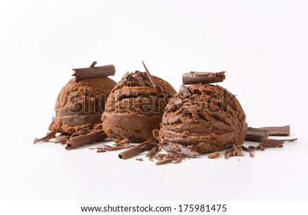 three scoops of ice cream decorated with chocolate flakes