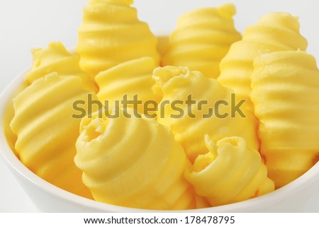detail of bowl with yellow butter curls