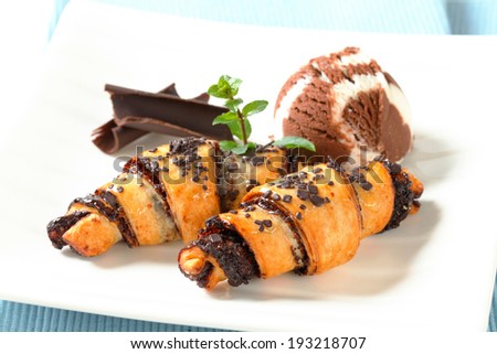 Chocolate chip croissants and scoop of vanilla chocolate ice cream