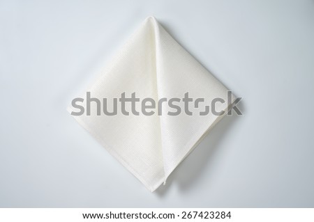 white folded napkin on white background