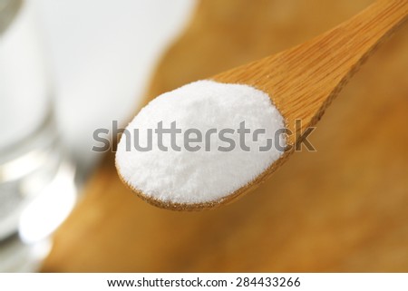 detail of cooking soda on wooden spoon