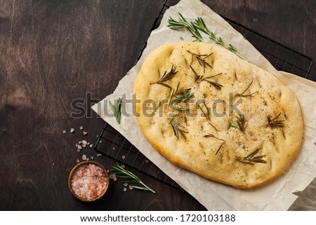 Similar – Foto Bild Hausgemachtes Rosmarin-Focaccia-Brot, Ansicht von oben, Nahaufnahme.