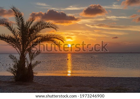 Watching the sunset from the beach in La Manga del Mar Menor, in the Autonomous Community of Murcia, Spain Foto stock © 