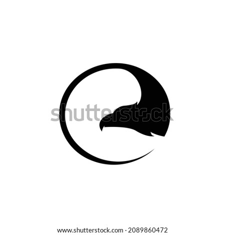 silhouette of flying hawk in the circle shape logo design vector