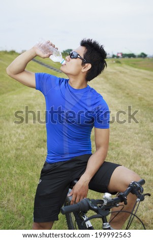 Mountain biker drinking water