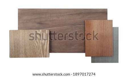 matching colors and textures of interior wooden material including oak engineer flooring ,grey ash and red douglas fir veneer ,brown walnut laminated samples isolated on white background. Foto d'archivio © 
