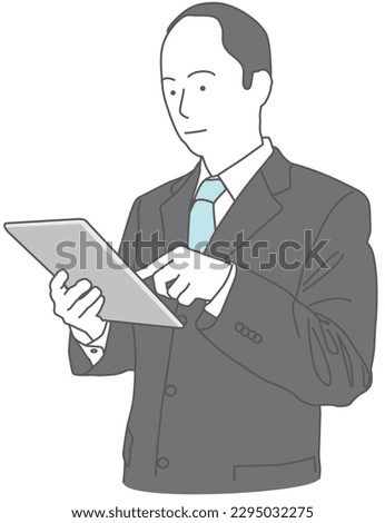 A man in a suit using a tablet device