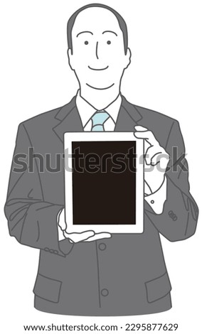 A man in a suit showing the screen of a tablet device