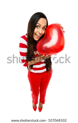 Valentines day portrait of Pretty Indian woman holding red heart on white background