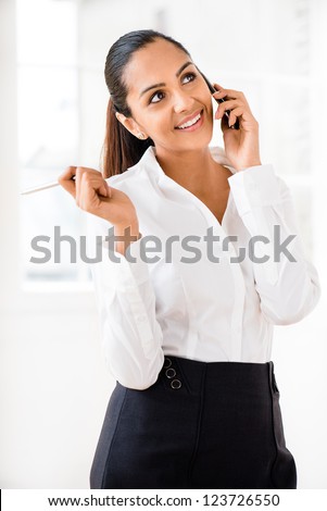 Indian business woman using mobile phone