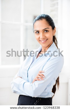 Beautiful young Indian business woman happy smiling