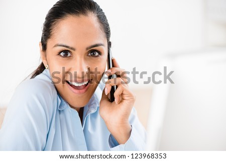 Indian business woman mobile phone excited