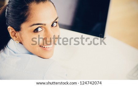 Indian business woman pretty vintage style portrait smiling office