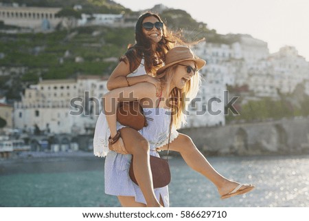 Similar – Image, Stock Photo Coastal landscape and girl in yellow hooded coat looking at sea and walking. Copy space.