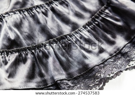 Beautiful shiny black skirt with lace