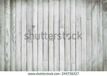 Gray wood plank vertical texture background, blur and grain old vintage style for design