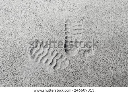 Texture of sand, footprints in the sand.