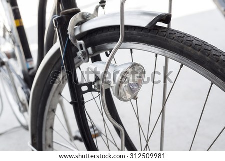 Old retro bicycle, front wheel and headlight