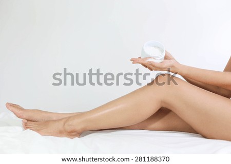 Selected focus on female holding sea salt in white background
