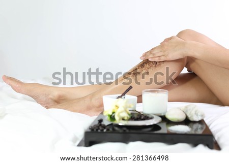 Women Cleaning skin massage with coffee grain ground  in white background
