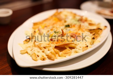 French fries and parmesan cheese  with ground paprika