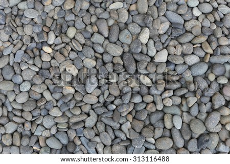 Smooth river pebble stone background texture