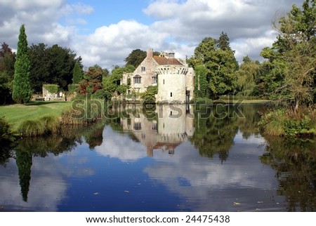 View of an old historical castle at lakeside. Tourist\'s attraction in England