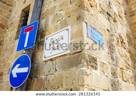 NICOSIA, CYPRUS - SEPTEMBER 14, 2014 : Nameplate sign of Buyuk Han (The Great Inn) Nicosia, North Cyprus. The Turkish part of Nicosia in North Cyprus.