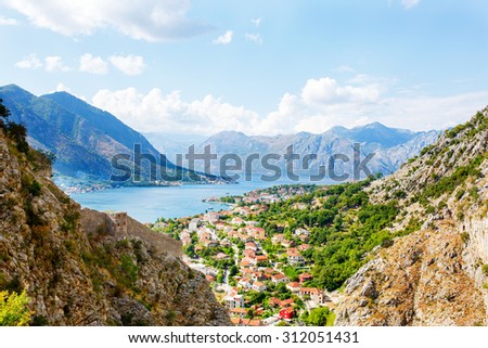 Kotor Bay, Montenegro. View of mountains, boats and old houses of the Kotor town.