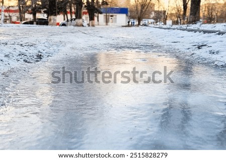 Similar – Foto Bild Pfützen auf einer Landstraße nach Regenfällen. Schwarz und weiß düstere Landschaft Szene