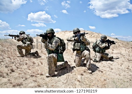 Squad of soldiers in the desert during the military operation