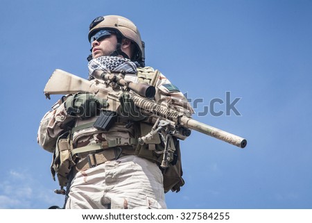 Member of Navy SEAL Team with weapons in action