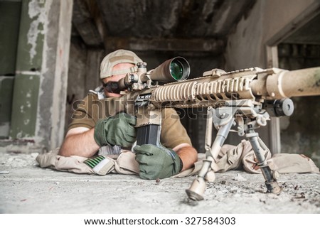 Navy Seal Sniper with rifle in action