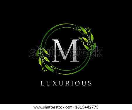 Elegant M Letter Green Floral Design. Circle Green Leaf M Logo Icon.