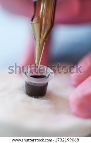 Similar – Image, Stock Photo Tattoo needle dipped in red paint